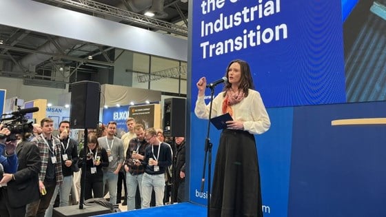 Picture of State Secretary Maria Varteressian on a stage with blue background