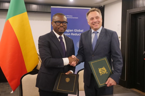 Benin's Minister of Economy and Finance Romuald Wadagni with Norway's Minister of Climate and Environment Tore O. Sandvik during the signing.